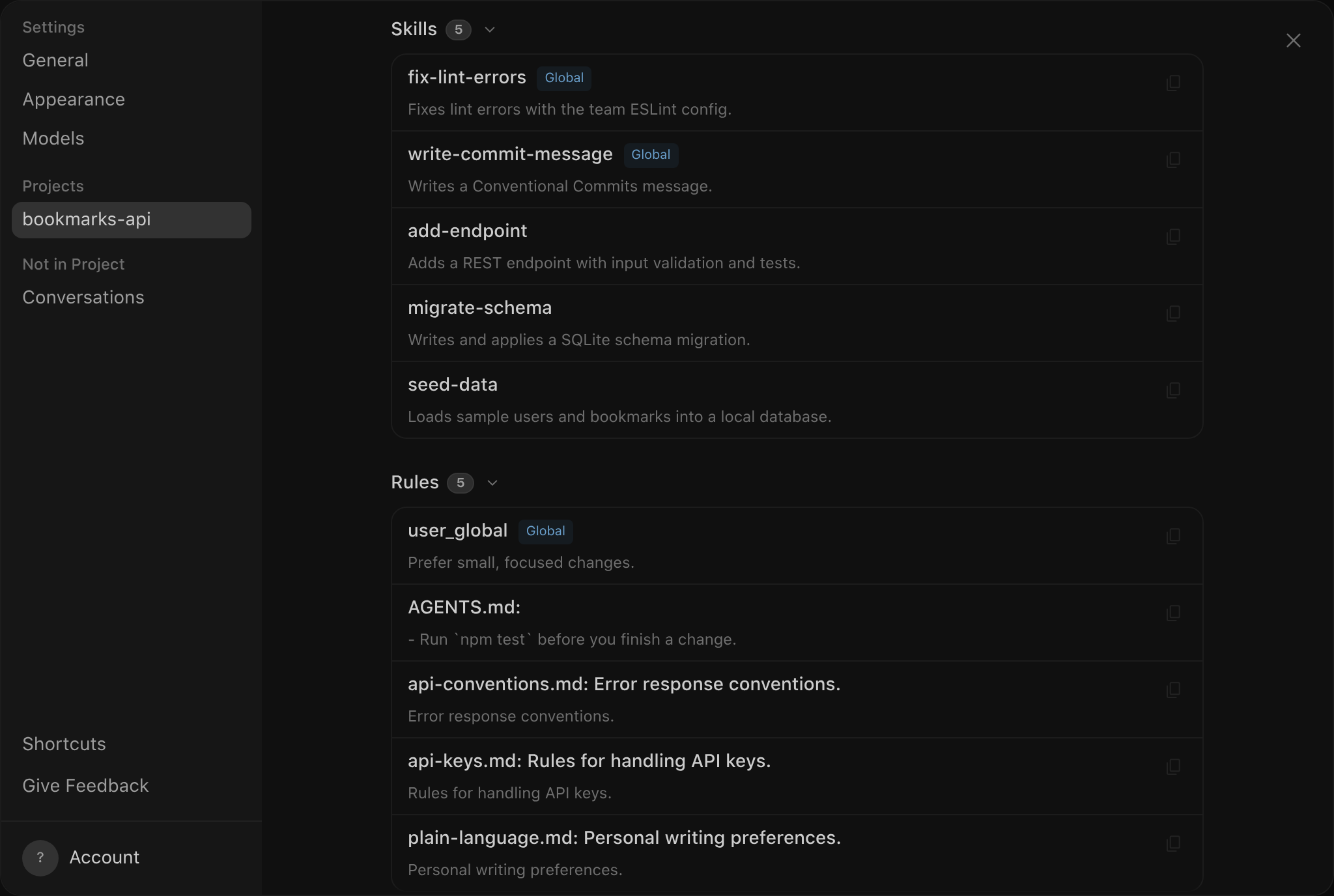 The Settings dialog in the Antigravity App with bookmarks-api selected under Projects, showing the Skills list with fix-lint-errors and write-commit-message badged Global followed by the workspace skills add-endpoint, migrate-schema, and seed-data, and the Rules list with user_global badged Global followed by AGENTS.md, api-conventions.md, api-keys.md, and plain-language.md